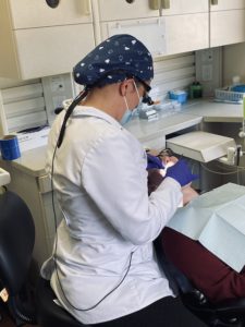 dentist cleaning a patient's teeth in Chardon, OH